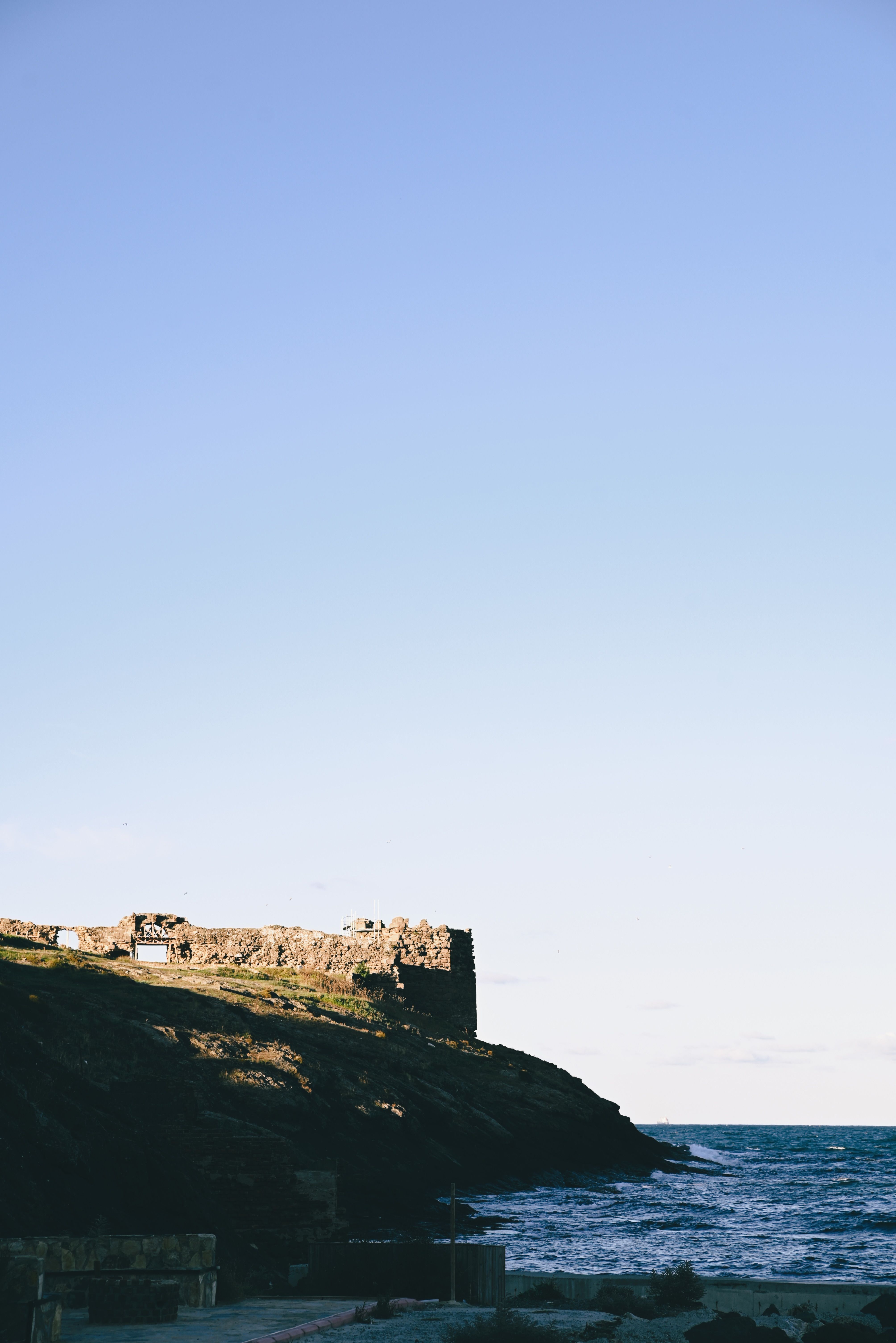 Buildings and Castle on Cliff in Ocean · Free Stock Photo