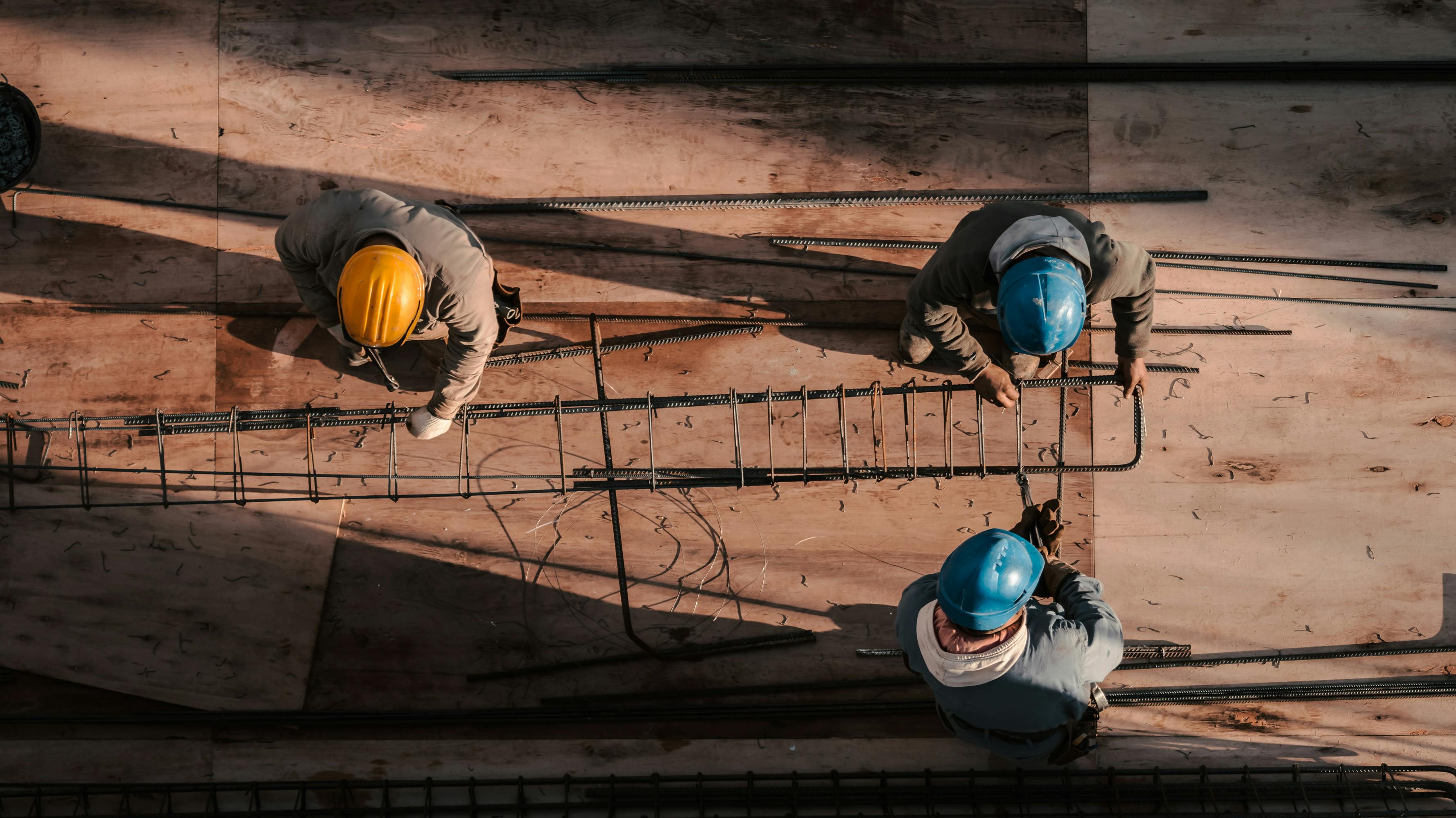 Two men with hard hats at construction site stock photo