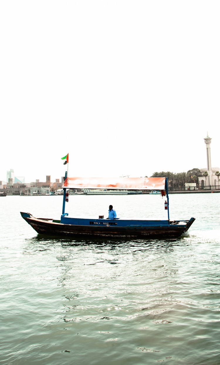 Wooden Motorboat Cruising The River