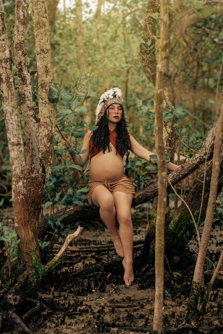 Beautiful Pregnant Woman Wearing Plume And Bikini