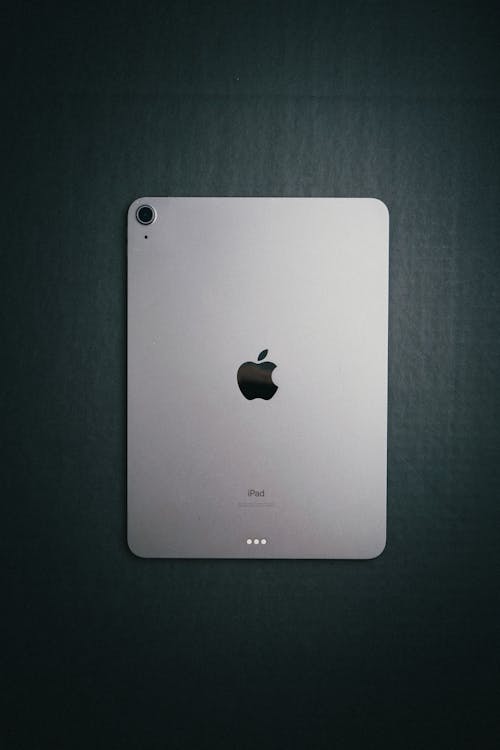 Silver iPad on Gray Surface