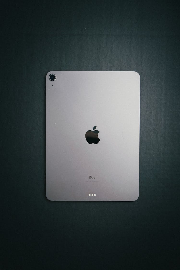 Silver IPad On Gray Surface