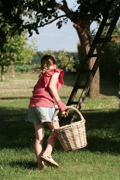 Young Girl Carrying a Basket