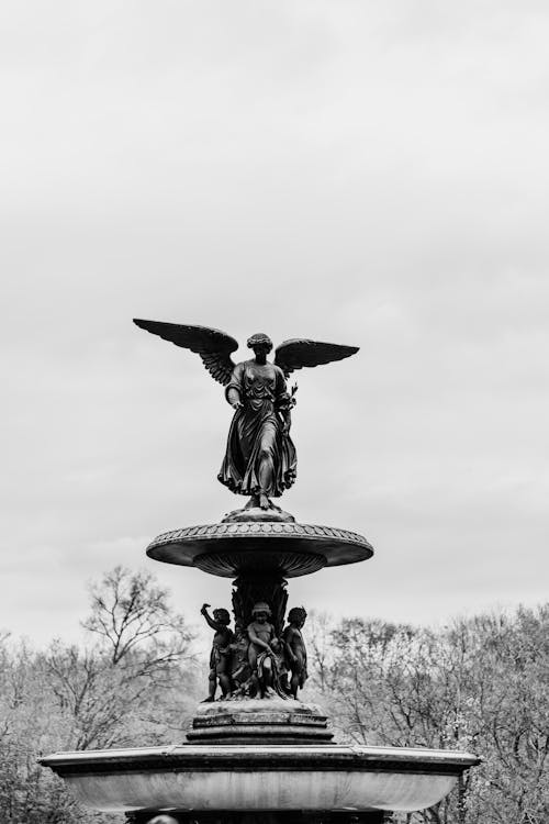 Grayscale Photo of the Angel of the Waters Statue
