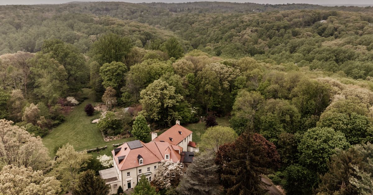 Aerial landscape of a secluded estate surrounded by dense forest in Bernardsville, NJ.