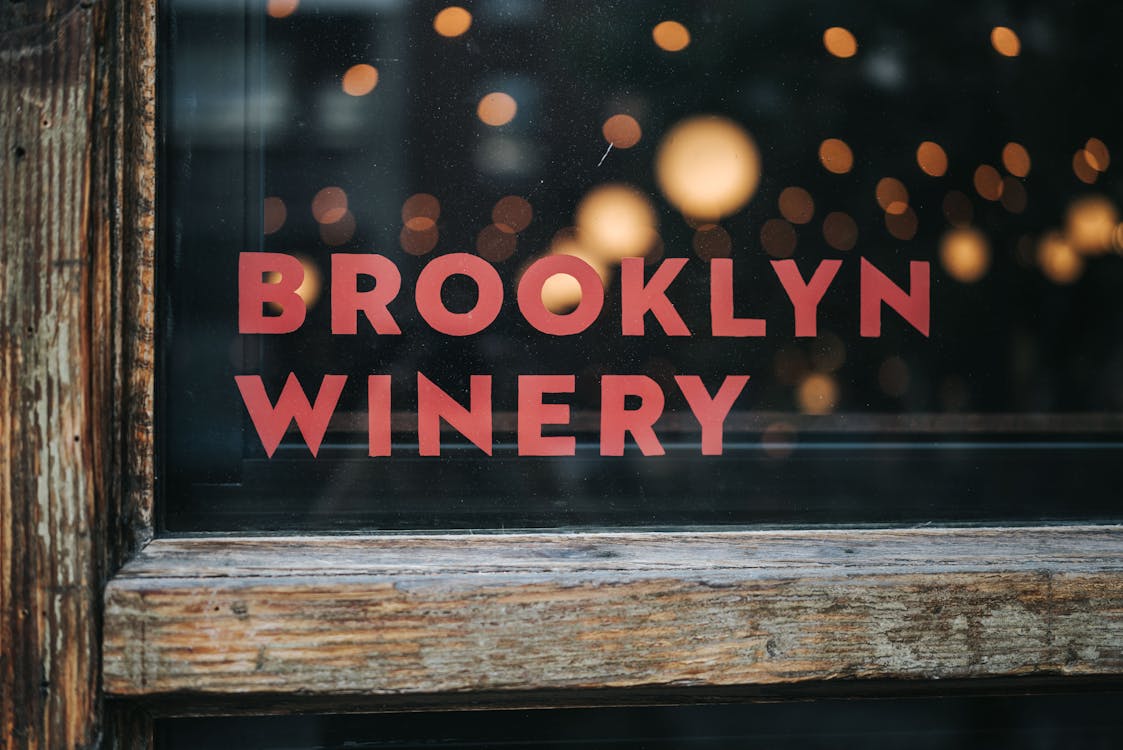 Free Close-up of Brooklyn Winery's vintage window design with blurred background lights. Stock Photo