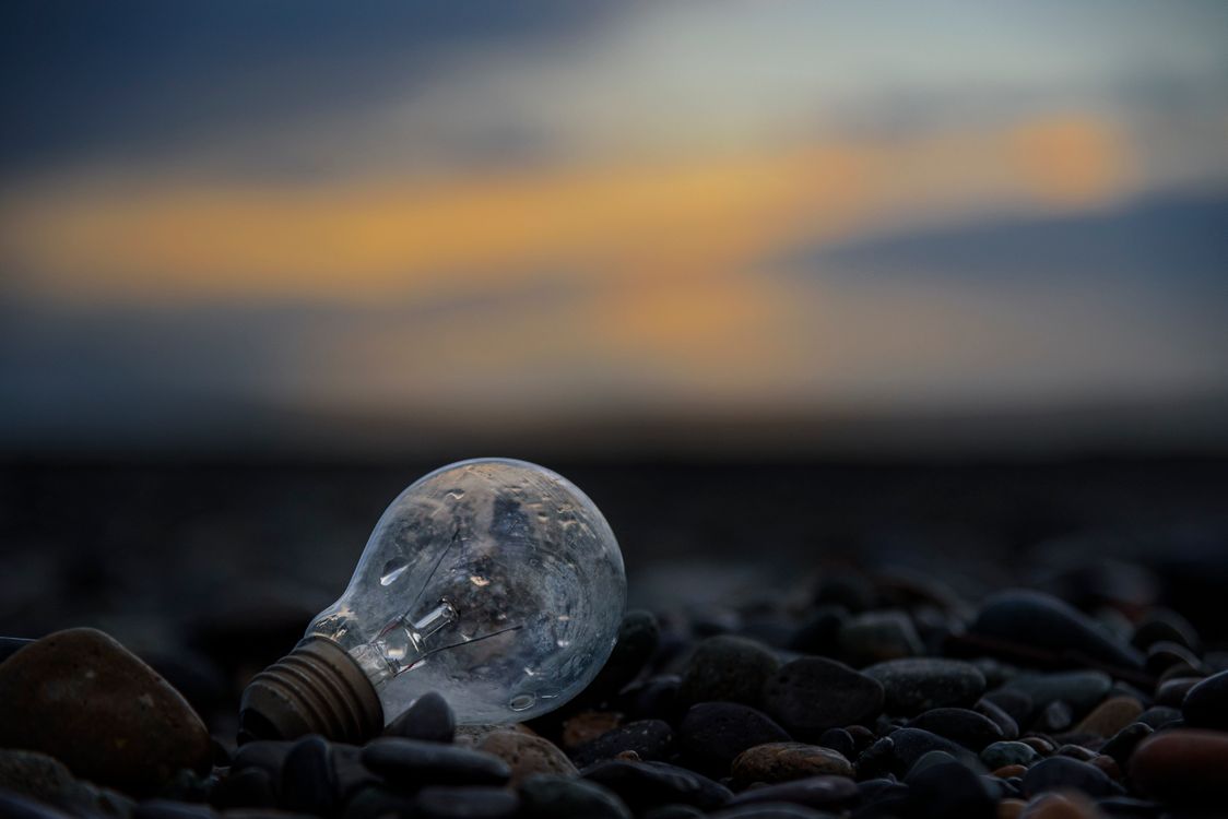 Light On Rocks A Lightbulb on Rocks · Free Stock Photo
