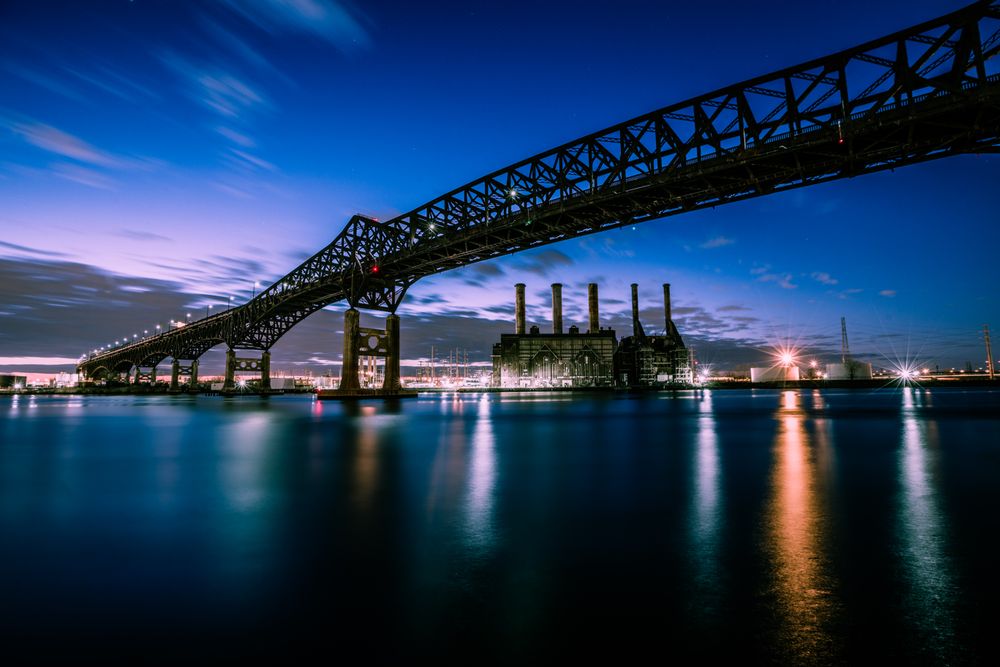 Stunning evening photograph of the Pulaski Skyway over water in New Jersey.