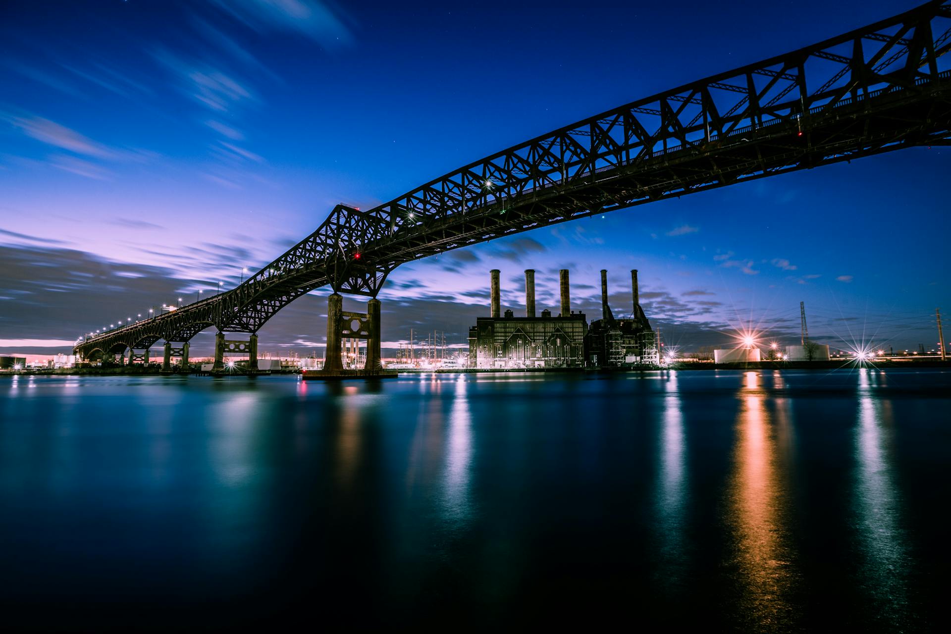 Stunning evening photograph of the Pulaski Skyway over water in New Jersey.