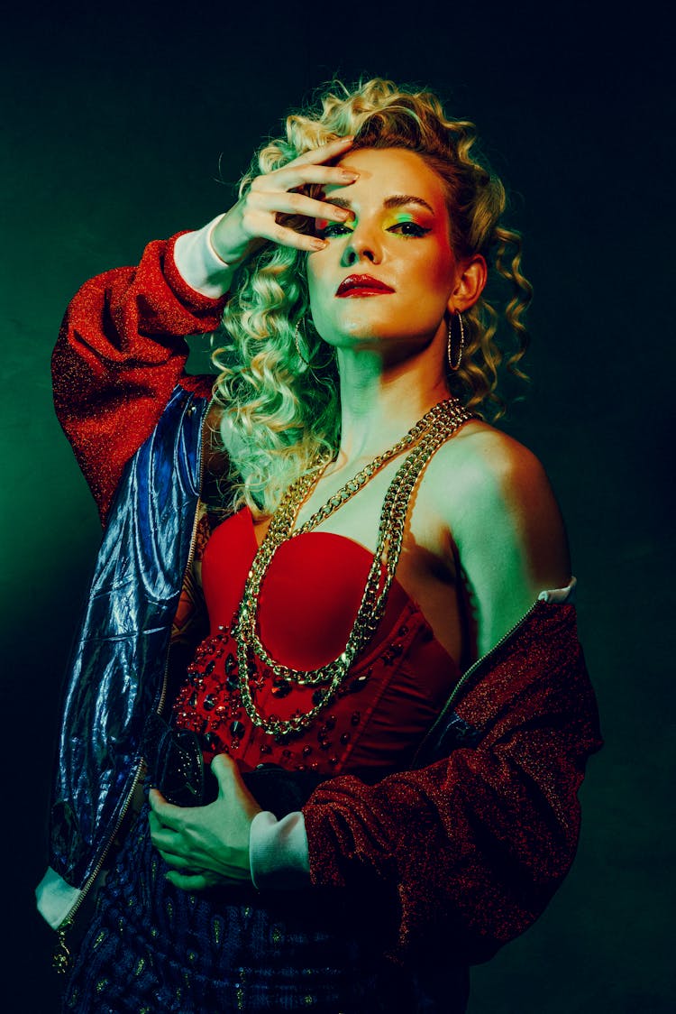 Woman Posing In Studio Wearing A Creative Colorful Outfit 