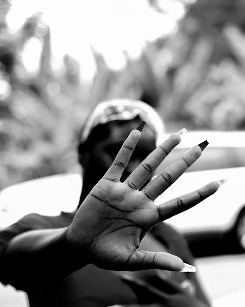 Black and White Photography Hand of a Woman with her Hand Reaching Forward 