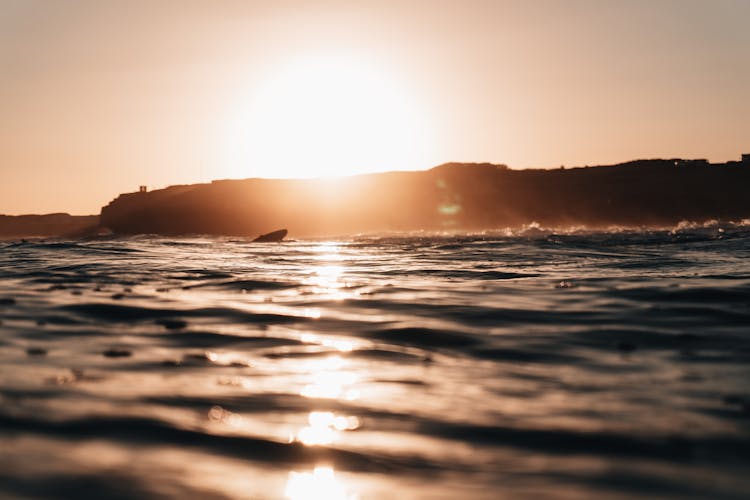 Setting Sun Over Sea Shore