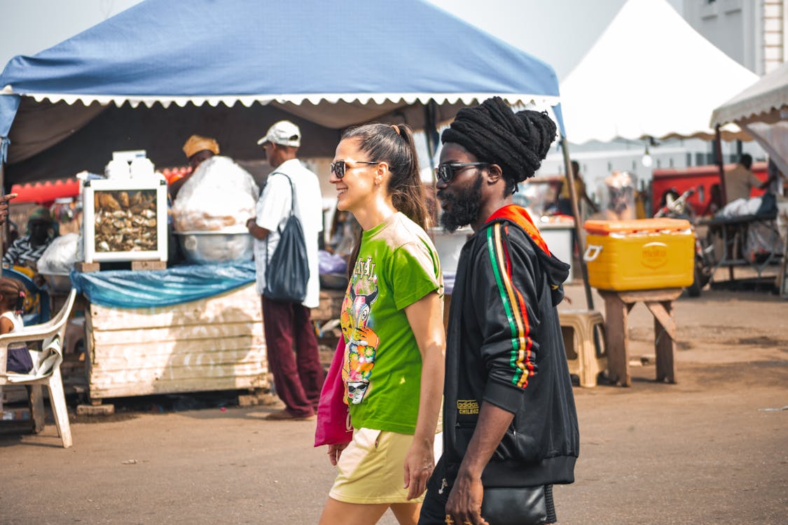 Young Couple Walking on a Street Market 