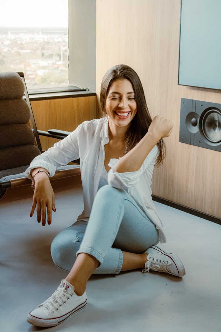 Laughing Woman Sitting On The Floor