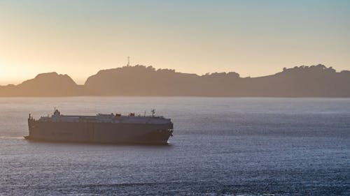 White Ship on Sea during Sunset