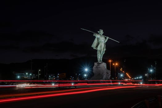 Long exposure of Al Chacho Pealoza statue at night in La Rioja, Argentina.