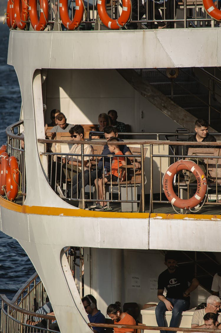 People Riding A Ferry Boat