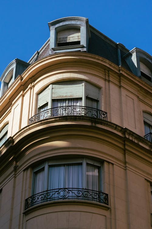 Concrete Building with Glass Windows and Balconies