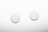 Two Caps against White Background