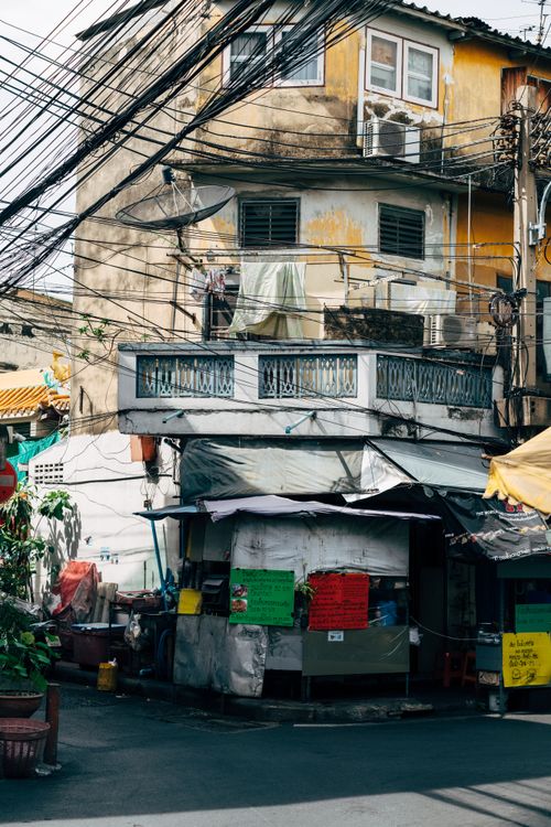 Free Colorful urban scene with old buildings, electric wires, and narrow streets. Stock Photo