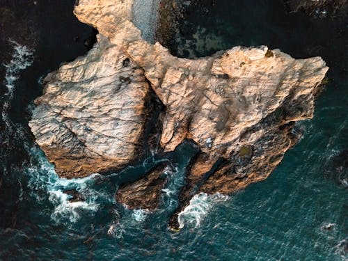 Rocky Island on a Body of Water