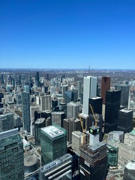 A breathtaking aerial shot of Toronto's skyline with skyscrapers under a clear blue sky.