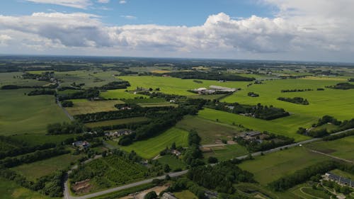 Aerial View of Green Grass Field under Blue Sky