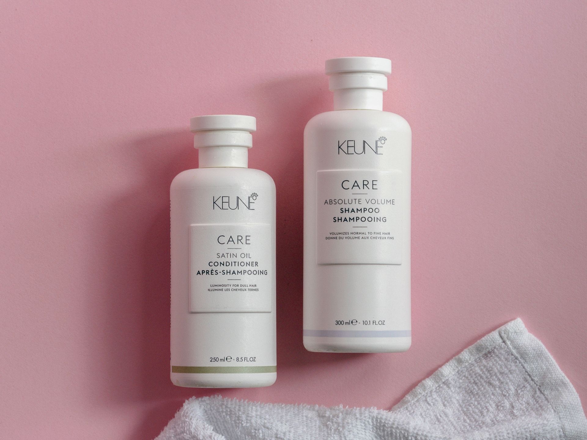 Shampoo and Conditioner on a Pink Surface