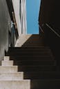 Gray Concrete Staircase Under Blue Sky