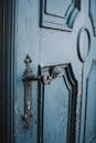 Metal Door Handle on a Blue Wooden Door