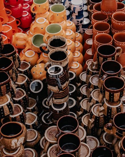 Overhead shot of stacked ceramic mugs and jugs — photo by Pramod Tiwari on Pexels