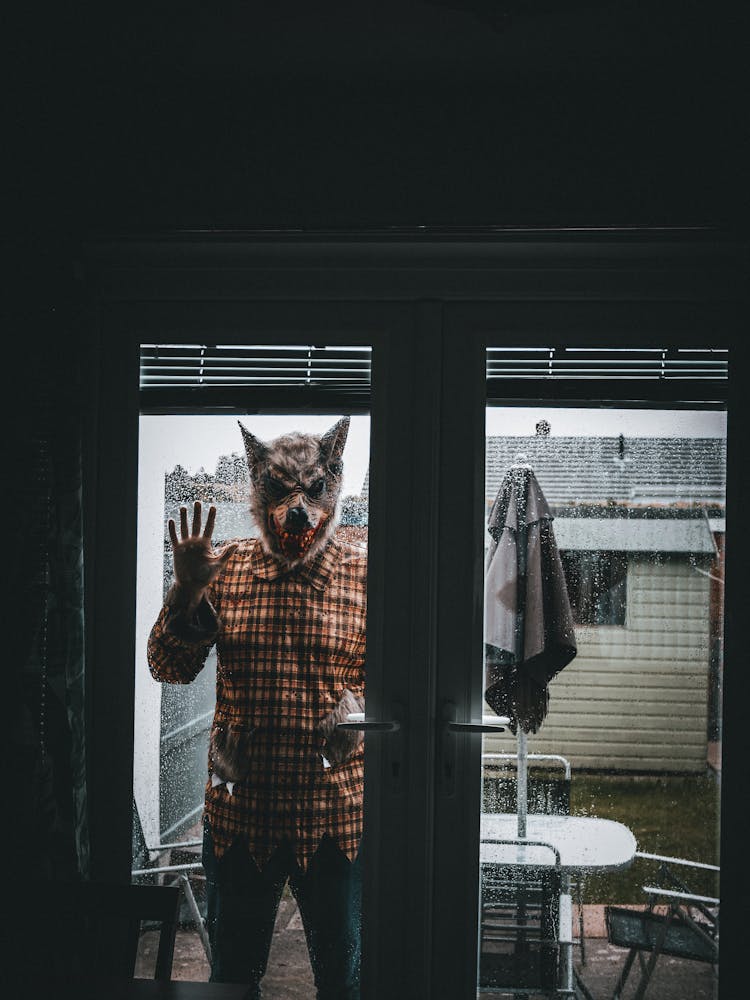 Man With A Realistic Wolf Mask Behind The Door 