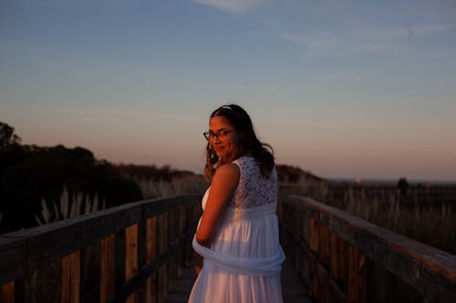 A Woman Wearing White Dress While Looking Back