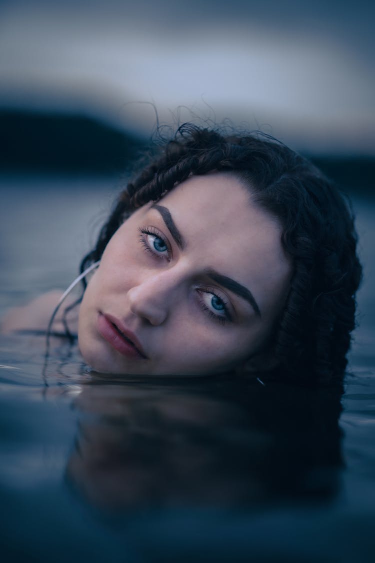 Close-up Of Woman Emerging From Water 