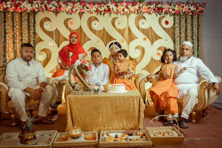 Bride In A Yellow Sari Posing With The Family On The Wedding 