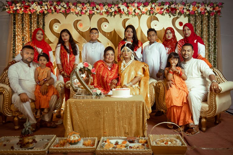 Family Posing By Decorated Table