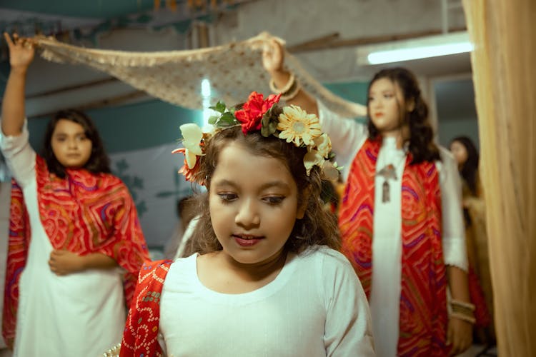 Girl With Wreath With Flowers On Ceremony