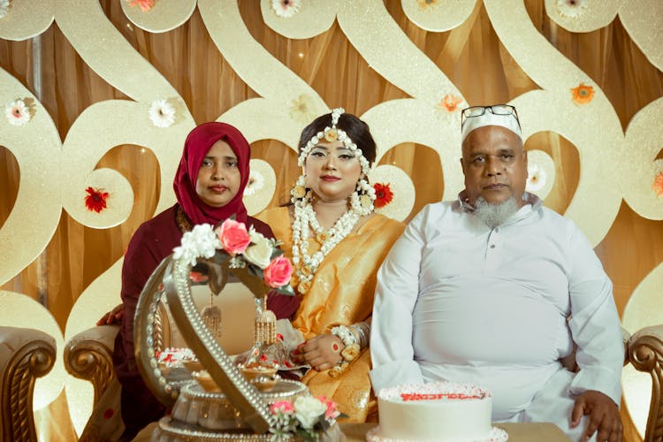 Beautiful Bride Sitting Between Her Parents