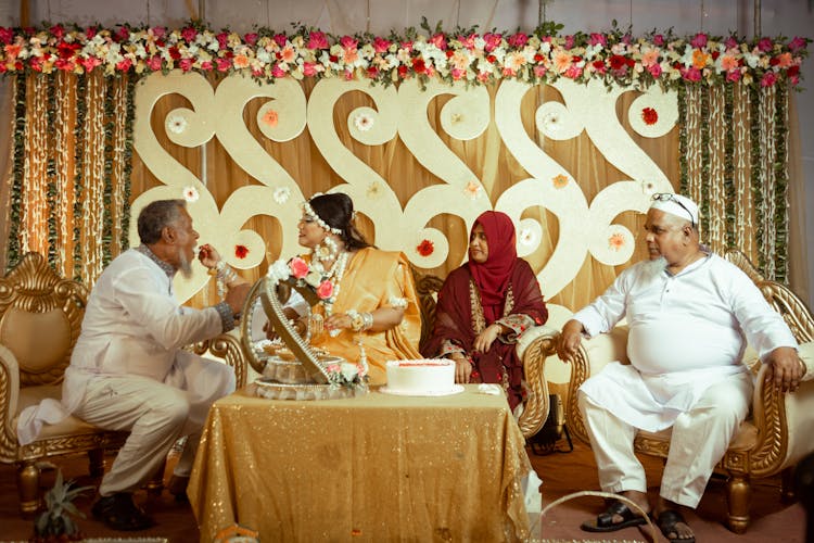 A Family Sitting At A Table