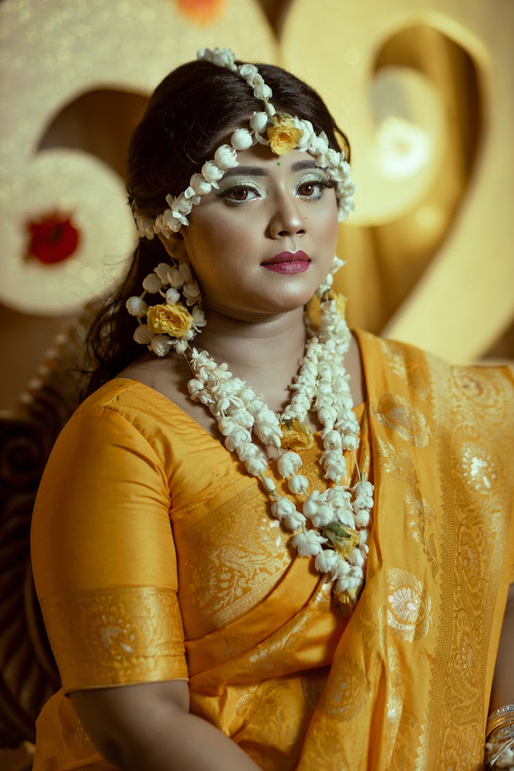 A Woman In Yellow Sari