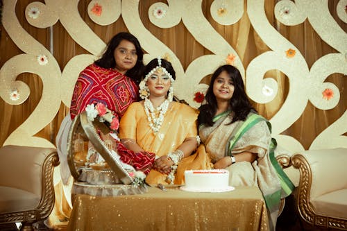 Beautiful Young Bride in Traditional Clothing Posing with Family 