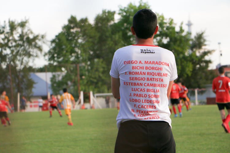 A Coach Observing A Soccer Team