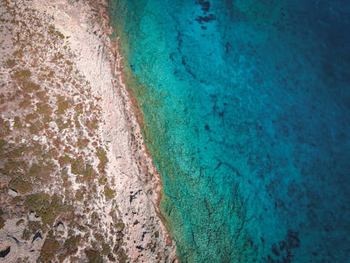 Aerial View of an Island and Turquoise Water