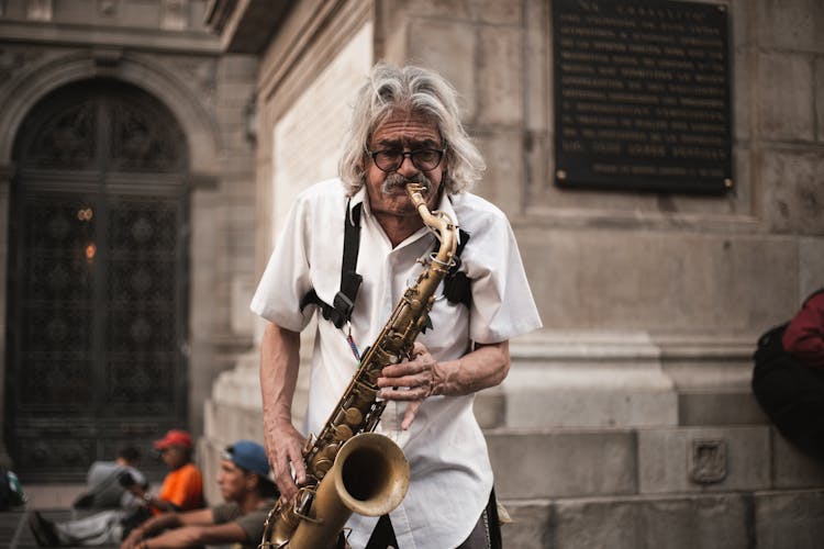 A Man Playing A Saxophone