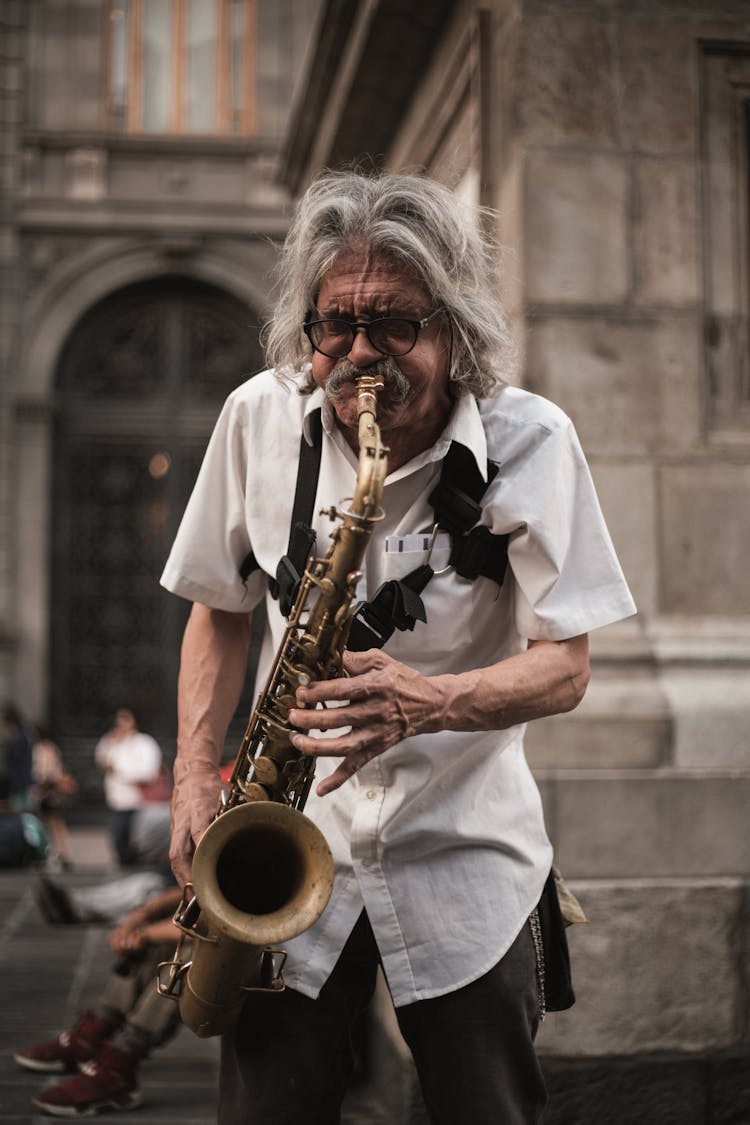 A Man Playing A Saxophone