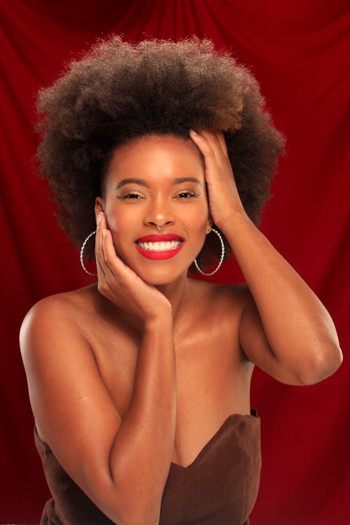 A Woman with Afro Hair Smiling