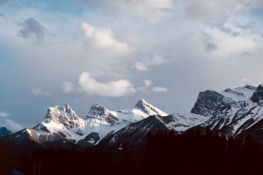 Stunning view of snow-covered mountains in Banff, Alberta, Canada, during winter.