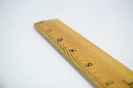 Brown Ruler on White Surface