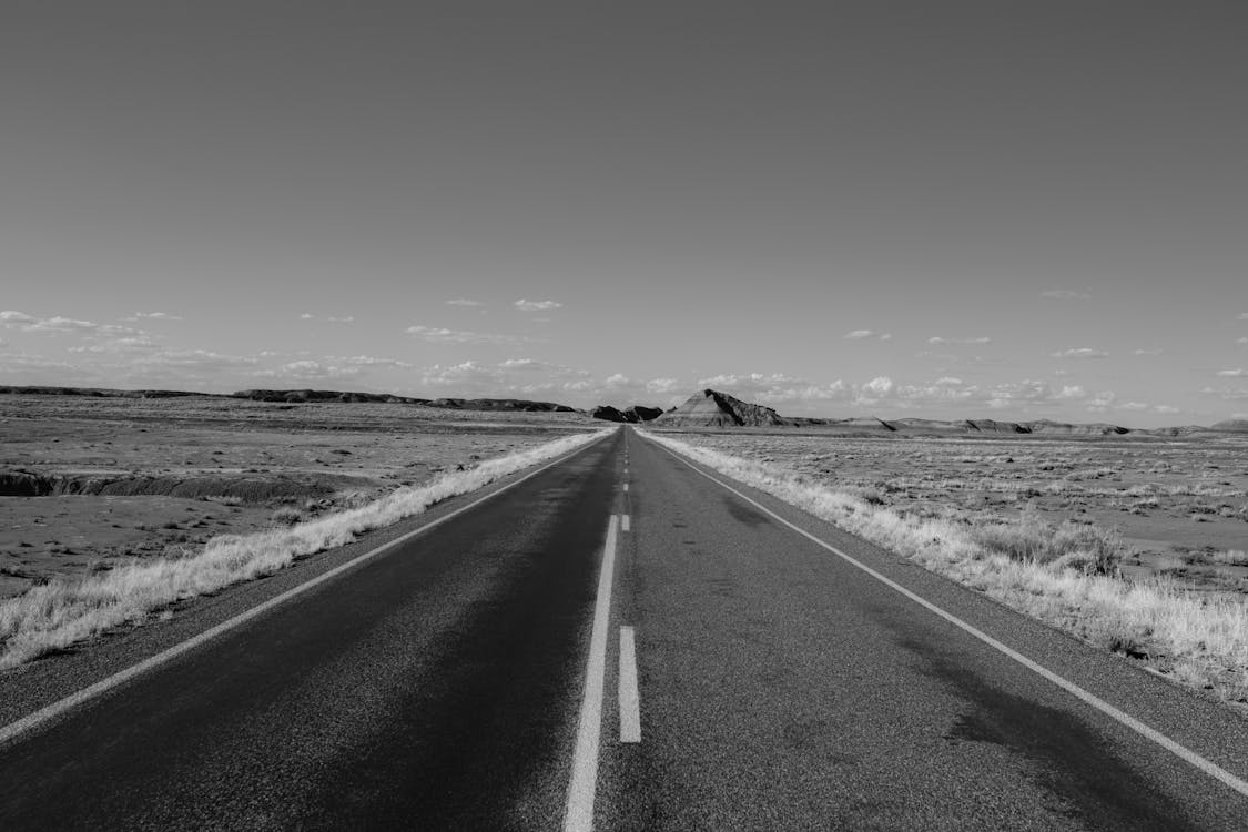 Black and White Photo of Empty Road