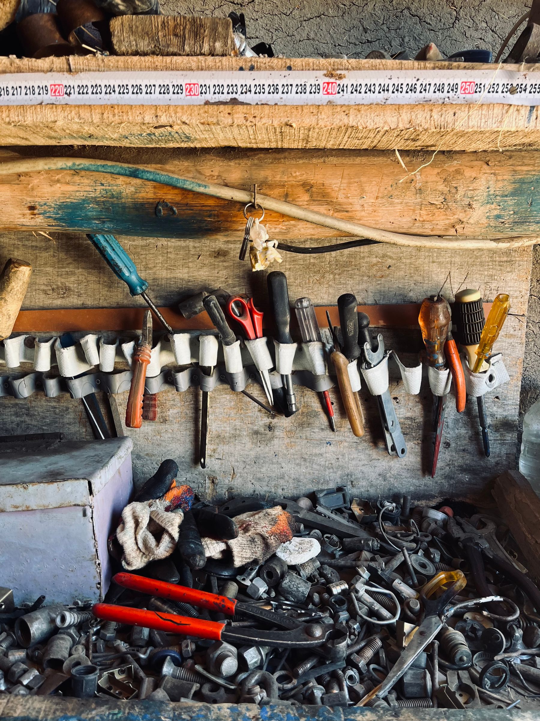 Tools arranged in a workshop box for organized inspection and handling